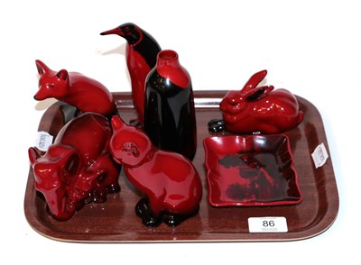 Lot 86 - Royal Doulton Flambe figures to include; Recumbent Hare, Penguin, seated Cat, Elephant and Calf...