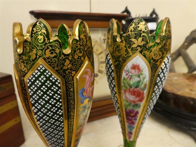 Lot 91 - A pair of Bohemian gilt decorated green glass vases with painted flowers