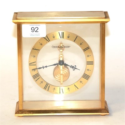 Lot 92 - A brass four-glass mantel timepiece, signed Jaeger-le-Coultre, circa 1970, single barrel single...