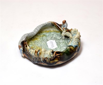 Lot 96 - An early 20th century Japanese figural mixed glaze dish, signed (a.f.)