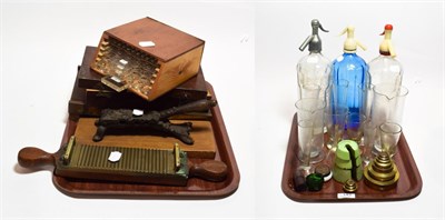Lot 143 - A group of pharmaceutical glass measures and weights, pill rollers, scales, x3 siphons