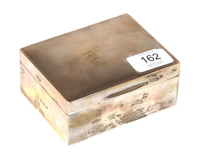 Lot 162 - An Elizabeth II silver cigarette-box, Birmingham, 1956, oblong and wood lined, the hinged cover...