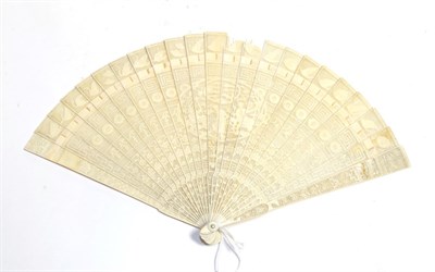 Lot 173 - An early 19th century Chinese carved ivory brisé fan, the twenty-one inner sticks and two...