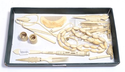 Lot 177 - A Stanhope and Japanese ivory comb, a quantity of ivory and bone