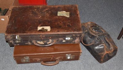 Lot 186 - Two leather suitcases and a Gladstone bag