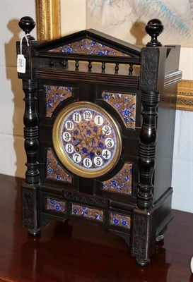 Lot 202 - An Aesthetic movement striking ebonised mantel clock, case depicting recessed transfer printed...