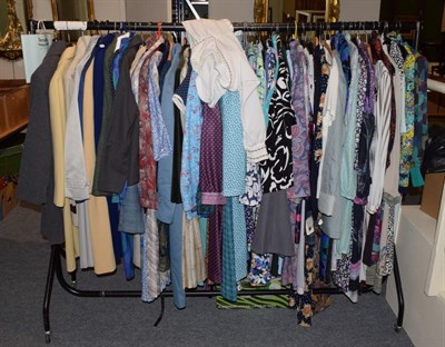 Lot 239 - Rail of mainly modern clothing, including dresses, separates, coats etc, one box of assorted...