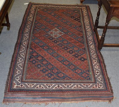 Lot 334 - A Kurdish rug, the central field of crowded hook geometric shapes, within narrow borders, 220cm...