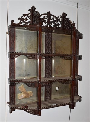 Lot 343 - A mirrored mahogany display shelf