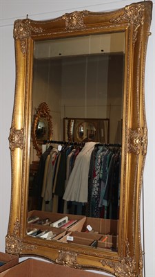 Lot 348 - ^ A large rectangular reproduction gilt framed mirror