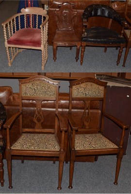 Lot 354 - A pair of early 20th century carved oak hall chairs in the Arts & Crafts taste, a leather...