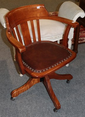 Lot 381 - An early 20th century swivel office chair