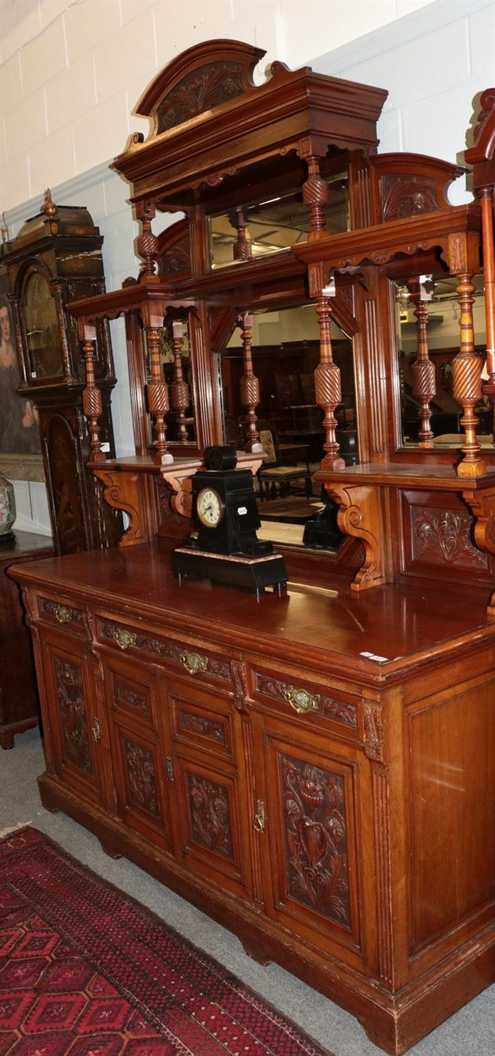 Lot 407 - ^ A late Victorian mirror-back sideboard, the impressive carved sectional mirror back with...