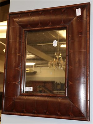 Lot 410 - A reproduction mahogany cushion framed mirror, the rectangular mirror plate within a conforming...