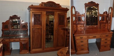 Lot 415 - ^ An early 20th century carved and panelled mahogany three-piece bedroom suite, comprising a...