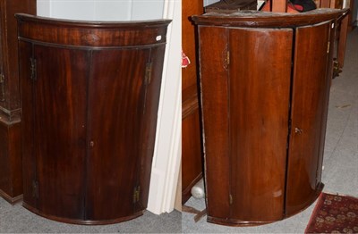 Lot 419 - A George III inlaid mahogany bow fronted hanging corner cupboard, 71cm by 50cm by 104cm high;...