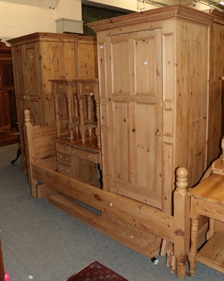 Lot 421 - ^ A matched pine bedroom suite (20th century), comprising two single wardrobes, each fitted...