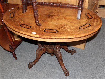 Lot 423 - An inlaid burr walnut oval tilt-top occasional table, the top on five turned supports, raised...