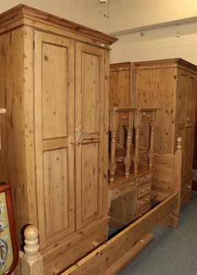 Lot 424 - ^ A matched pine five-piece bedroom suite, comprising two single wardrobes, each fitted with...