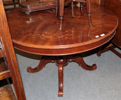 Lot 429 - An Italian reproduction walnut marquetry decorated pedestal dining table, 120cm diameter by...