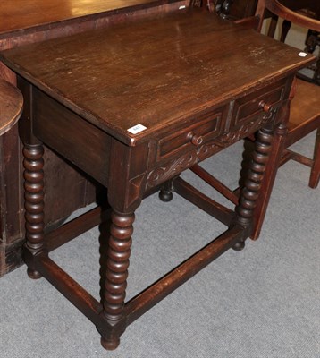 Lot 441 - A 17th century style oak side table with two small drawers and turned legs, 76cm by 47cm by...