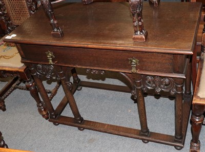 Lot 442 - A 17th century style oak side table, fitted with a drawer and raised on tapering cylindrical...