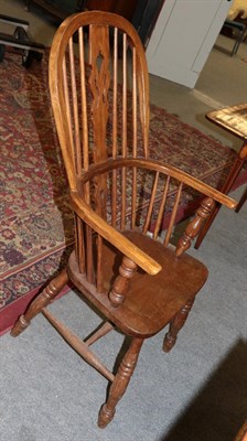 Lot 450 - A Windsor chair, spindle back with pierced splat, on turned legs