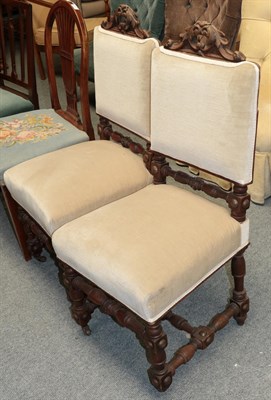 Lot 460 - A pair of Victorian carved oak chairs with upholstered seats