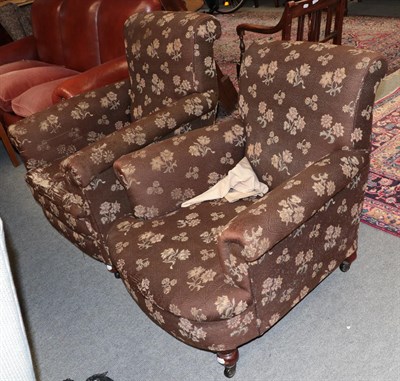 Lot 462 - A pair of mahogany framed armchairs upholstered in brown floral fabric