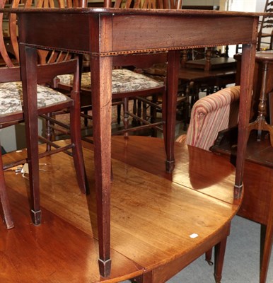 Lot 484 - An Edwardian inlaid mahogany, serpentine fronted hall table, raised on square section tapering...