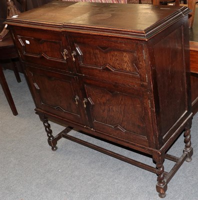 Lot 485 - An oak four door cupboard (converted)