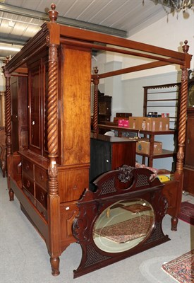 Lot 486 - ^ A reproduction mahogany four poster bed, the four boldly turned uprights, surmounted by...