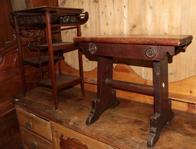 Lot 492 - A mahogany side table in the Orientalist taste (20th century) and an oak Gothic style stool (2)