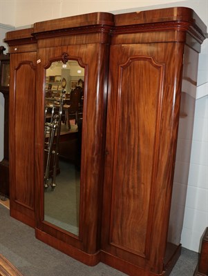 Lot 501 - ^ A substantial Victorian breakfront mirrored triple door wardrobe with fully fitted and lined...