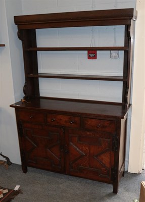 Lot 505 - An 18th century oak dresser, the rack with two fixed shelves, the base with three drawers above...