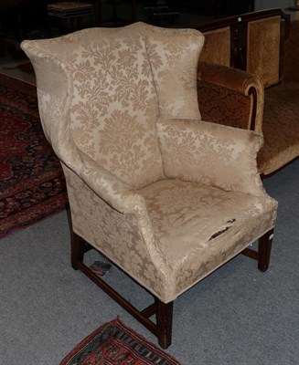 Lot 530 - A George III mahogany framed wingback armchair