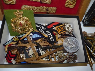 Lot 58 - King's Dragoon Guards, a glazed display of a pair of gold braid epaulettes and shoulder boards to a