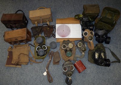 Lot 61 - Five Second World War Gas Masks, with two webbing cases; also, eight 1970's/80's gas masks and...