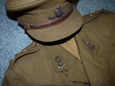 Lot 93 - A Second World War No.2 Dress Uniform to a Captain, Royal Artillery, comprising a peaked cap...