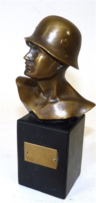 Lot 107 - A Small Bronze Bust of a German SS Soldier, on a black marble pedestal set with a brass vacant...