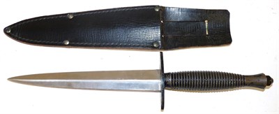Lot 121 - A Third Pattern Commando Knife, the 17.3cm machine forged steel blade laser etched with maker's...