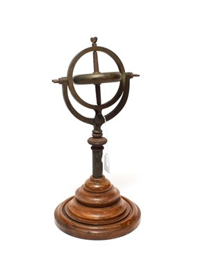 Lot 2090 - Brass Gyroscope on two axis mount on turned mahogany base disc 3 1/2'', 9cm diameter, overall...