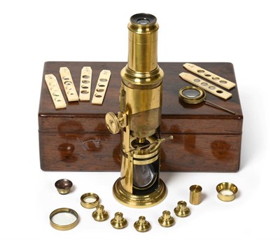 Lot 2102 - Brass Drum Microscope with rack and pinion focusing (teeth damaged) and concave mirror, in mahogany