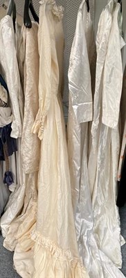 Lot 2205 - Six circa 1950-80's wedding dresses in ivory and cream including a Laura Ashley cotton example