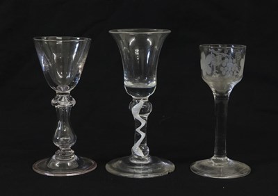 Lot 1 - A Balustroid Wine Glass, circa 1740, the rounded funnel bowl over an annular knop on a hollow...