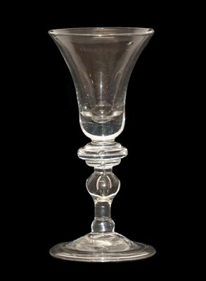 Lot 8 - A Balustroid Wine Glass, circa 1740, the bell shaped bowl over an annular knop and stem with...