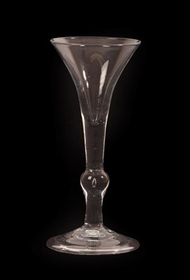 Lot 11 - A Wine Glass of Kit-Kat Type, circa 1720, the drawn trumpet bowl on knopped stem and folded...