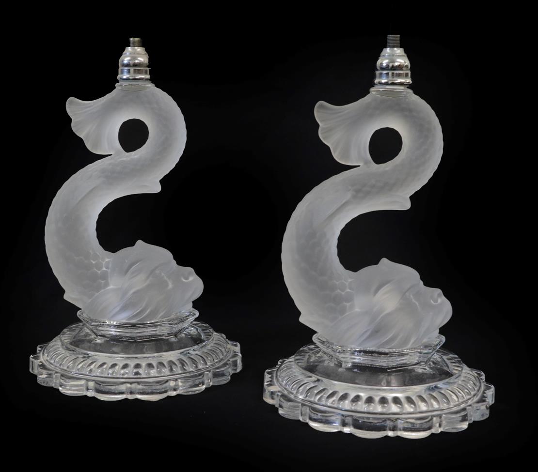 Lot 21 - A Pair of Baccarat Dauphin Glass Table Lamps, 20th century, modelled in the form of dolphins on...