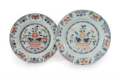 Lot 23 - A Matched Pair of English Delft Plates, mid 18th century, painted in colours with baskets of...