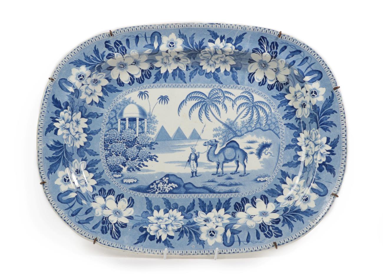 Lot 42 - A Pearlware Meat Platter, circa 1830, printed in underglaze blue with a camel and rider,...